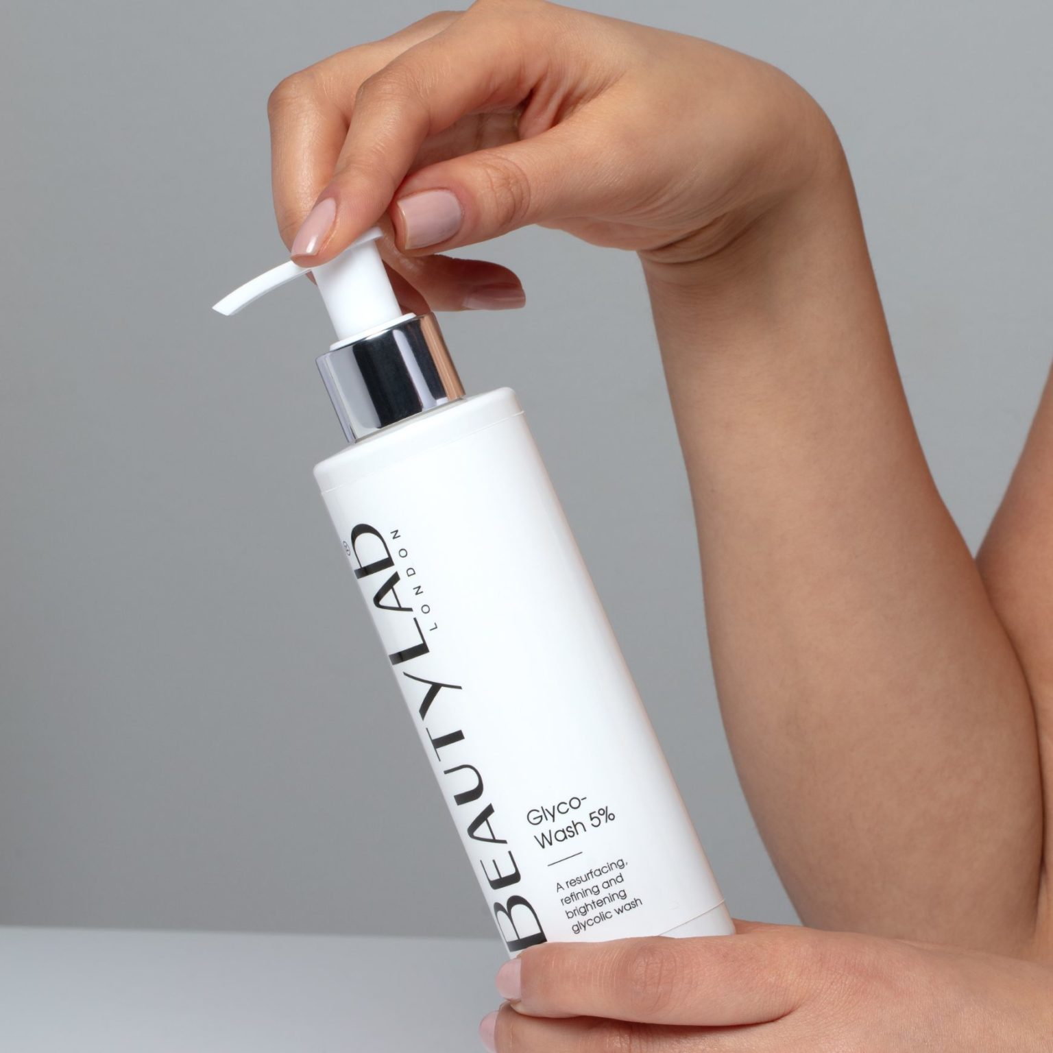 Model holding a bottle of Glycowash 5%