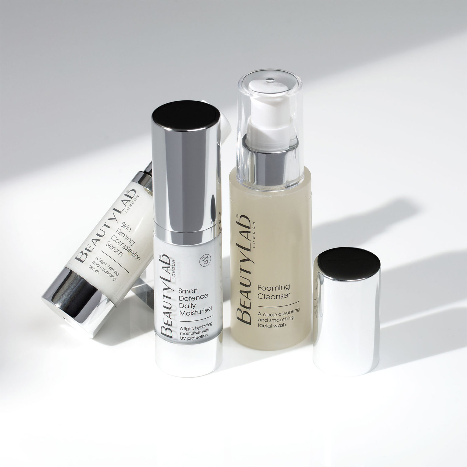 Skin Firming Complexion Serum, Smart defence Daily Moisturiser and Foaming Cleanser agaisnt a white background