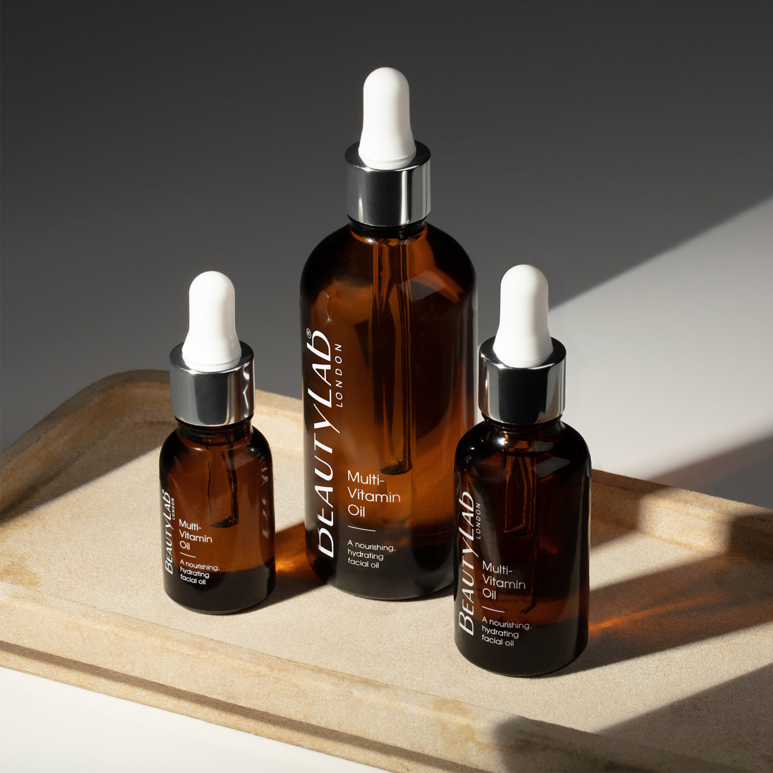 BEAUTYLAB® MULTI-VITAMIN OIL on top of a wooden tray