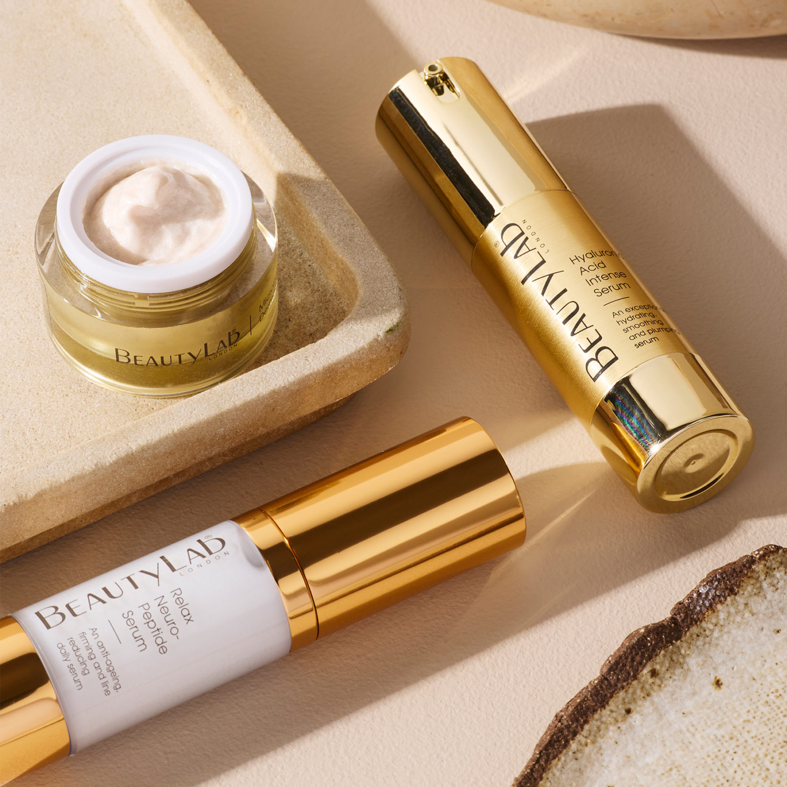 Hyaluronic Acid Intense Serum and Relax Neuro-Peptide Serum arranged on a neutral surface